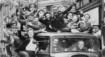 Ve Day Celebrations in London, 8 May 1945, A truck of revellers passing through the Strand, London