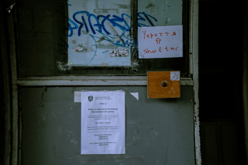 Notes at the main entrance of a residential building in Lviv, Photo Olha Klymuk